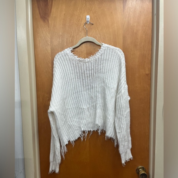 The Native One knit Elegant Frayed Hem Sweater in White - Picture 1 of 4